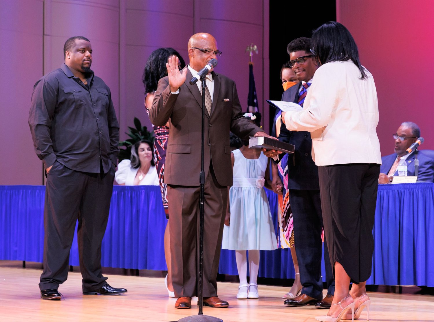 Derrick Thompson takes the oath of office to become a member of the Fayetteville City Council on Thursday night.