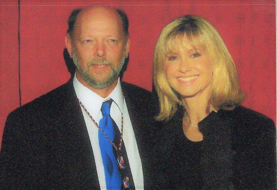 Paul Beard, manager of the Florence Center in Florence, S.C., is pictured with singer Olivia Newton-John when she performed at Fayetteville's Crown Complex in 2003.