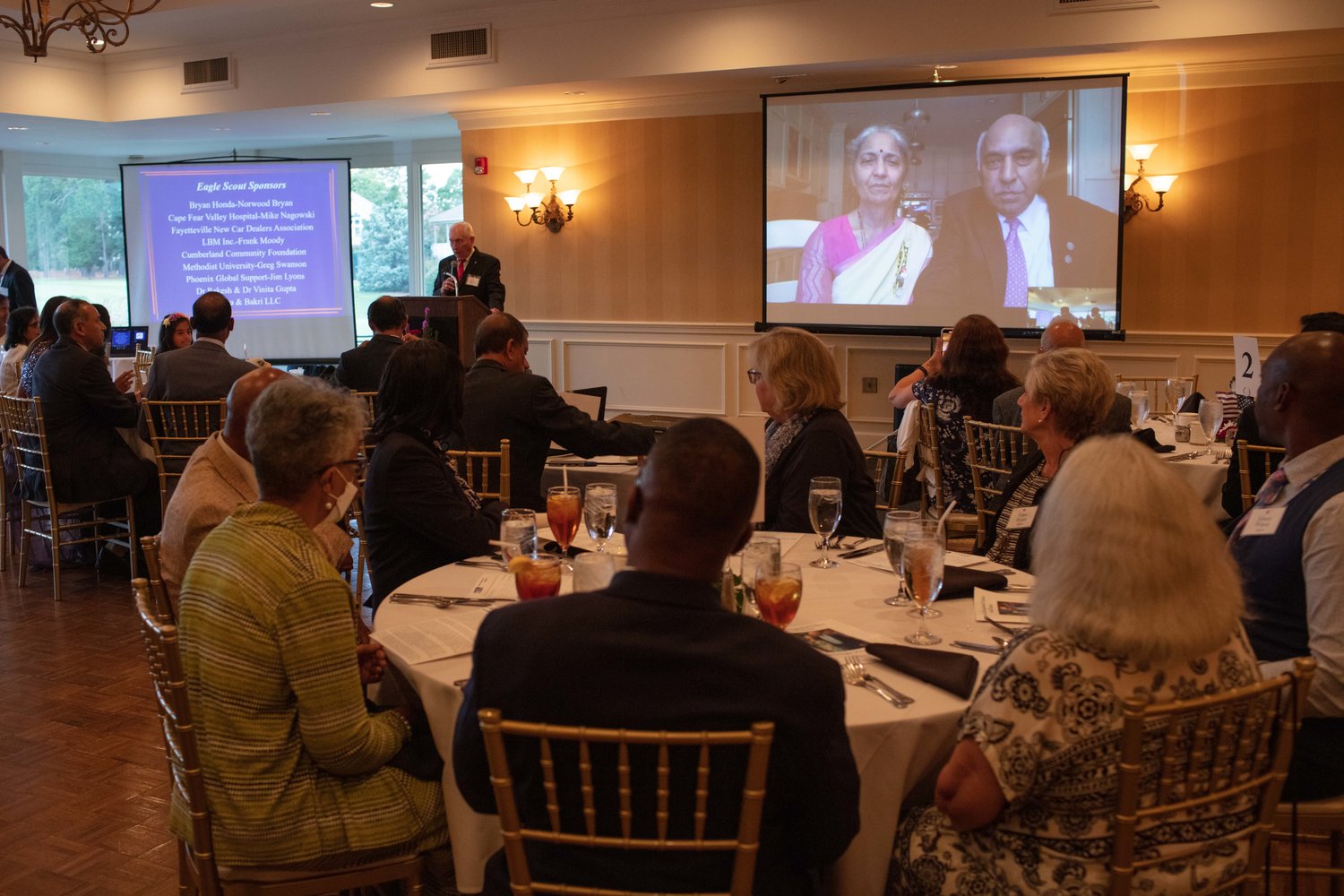 Attendees listen to the speaker during the Cumberland County Boy Scouts of America Occoneechee Council’s annual Distinguished Citizen Award Dinner on Aug. 18, 2022, at Highland Country Club.