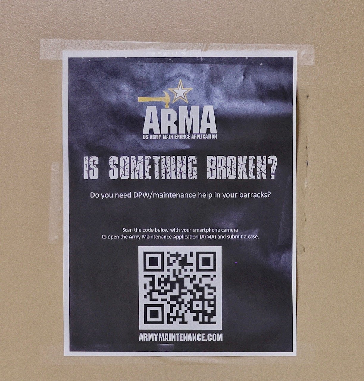 A poster urges soldiers to report issues with their living quarters. The poster includes a QR code that allows a soldier to scan the poster with a smartphone to connect and report the issue.