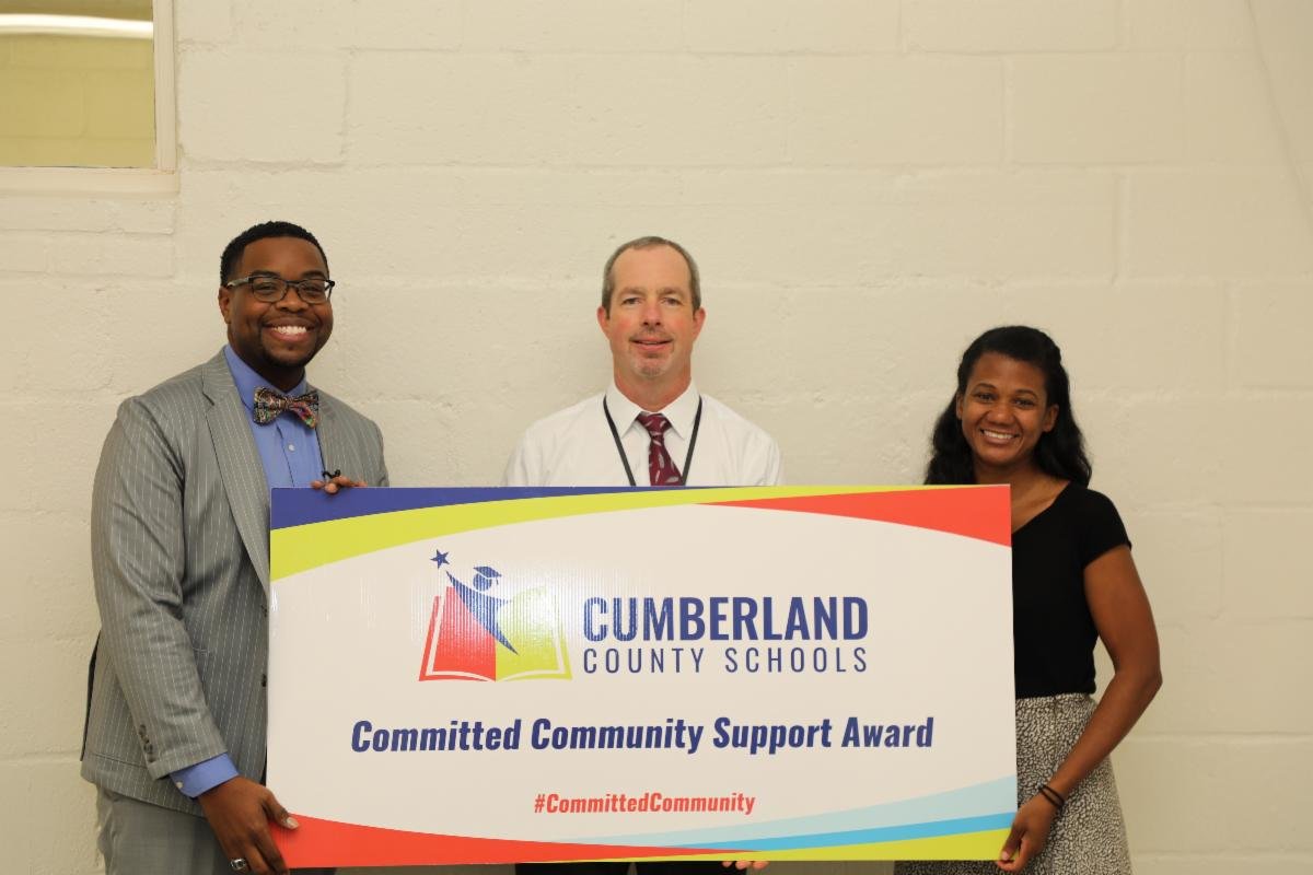 Lindsay Whitley, associate superintendent of Communications and Community, with Dr. Chris Tart and Dr. Jennifer Green, who were recognized with the August Committed Community Support Award by Cumberland County Schools. Not pictured is Dr. Roxie Wells, who also was recognized with the award.