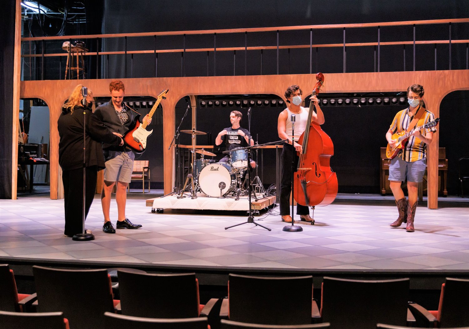 The cast of Cape Fear Regional Theatre's "Buddy: The Buddy Holly Story" get some technical direction on stage.