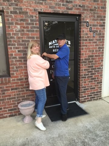 Cindy and Nathan Page lock the door to Nathan’s Auto Repair on Sept. 15 after 41 years.