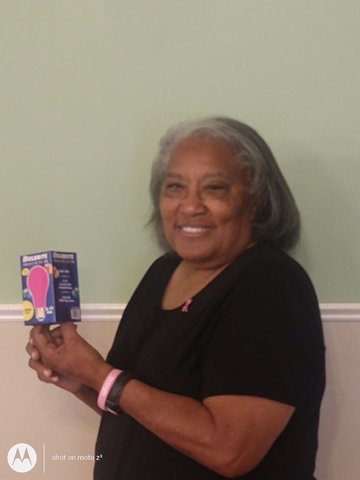 Gladys Hill has been selling pink lightbulbs since 2017. She wants to see the city bathed in pink light for Breast Cancer Awareness Month.