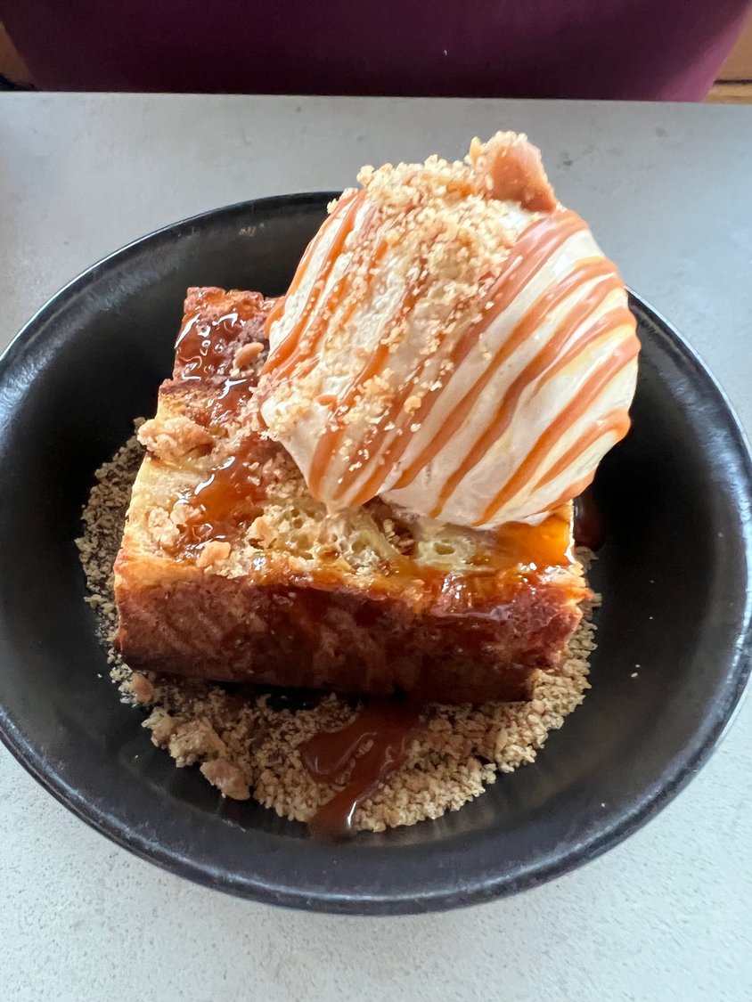 Bread pudding topped with salted caramel ice cream.