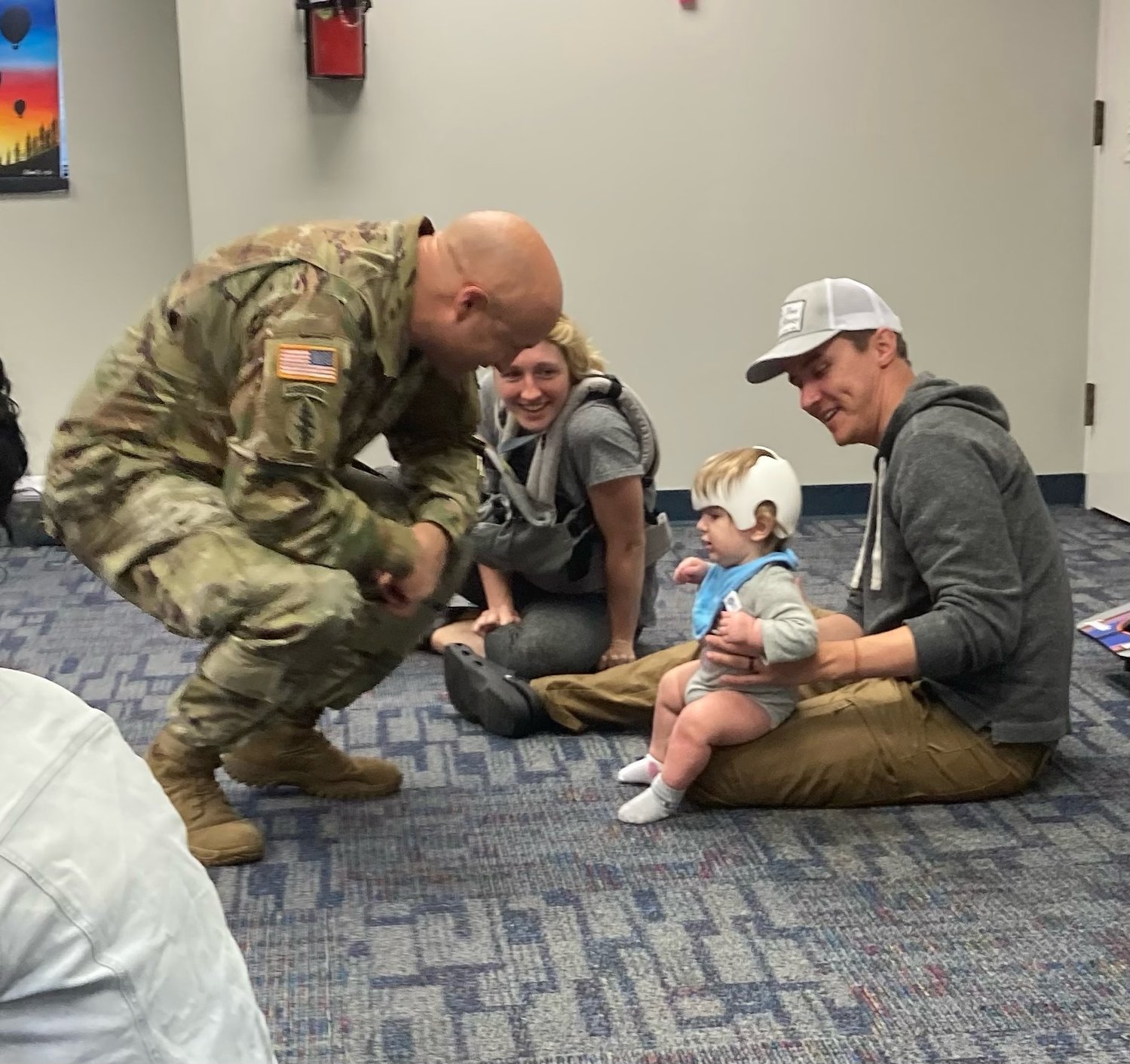 Col. John Wilcox, the Fort Bragg garrison commander, greets storytime visitors to Throckmorton Library on Wednesday. The library celebrated 25 years of serving the Fort Bragg community.