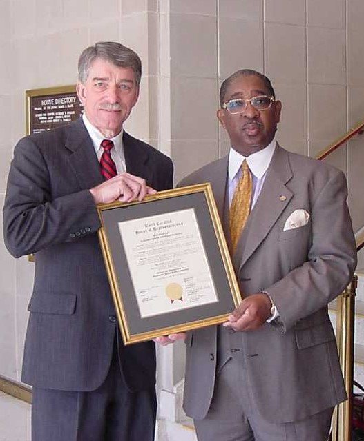 Joe Hackney, the N.C. House speaker pro tem, and Wilson Lacy in March 2005 when the Public Works Commission was recognized by the legislature on the utility's 100th anniversary.