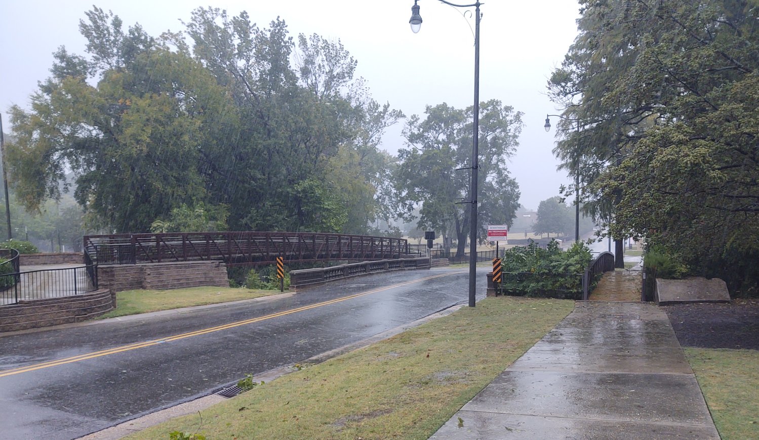 Strong wind and rain batter the Ray Avenue bridge over Cross Creek in downtown Fayetteville just before 5 p.m. Friday as the remnants of Hurricane Ian passed through the region.