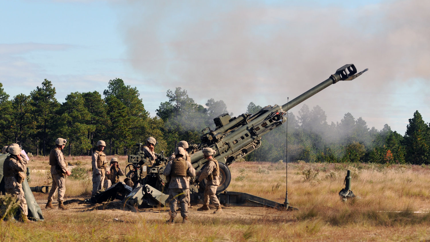 Marines from the 1st Battalion, 10th Marine Regiment shoot 155mm ammunition from a Howitzer on Oct. 14, 2011, during training at Fort Bragg. The Camp Lejeune-based Marines are back at Fort Bragg to conduct their semi-annual field artillery section certifications, command-post exercise and live-fire training as part of Operation Rolling Thunder.