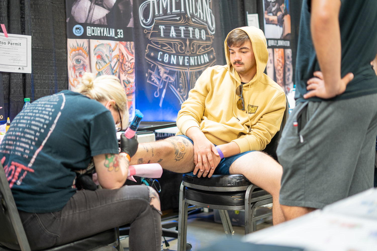 Dakota Watkins getting a tattoo at this year's Comic Con.