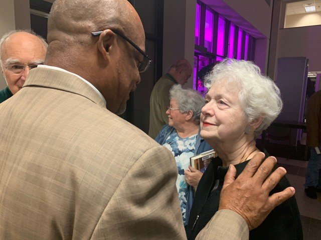 City Councilman Derrick Thompson talks with Mary Lynn Bryan after Monday night’s vote for the city to provide $6.6 million toward construction of the N.C. History Center on the Civil War, Emancipation & Reconstruction structure.