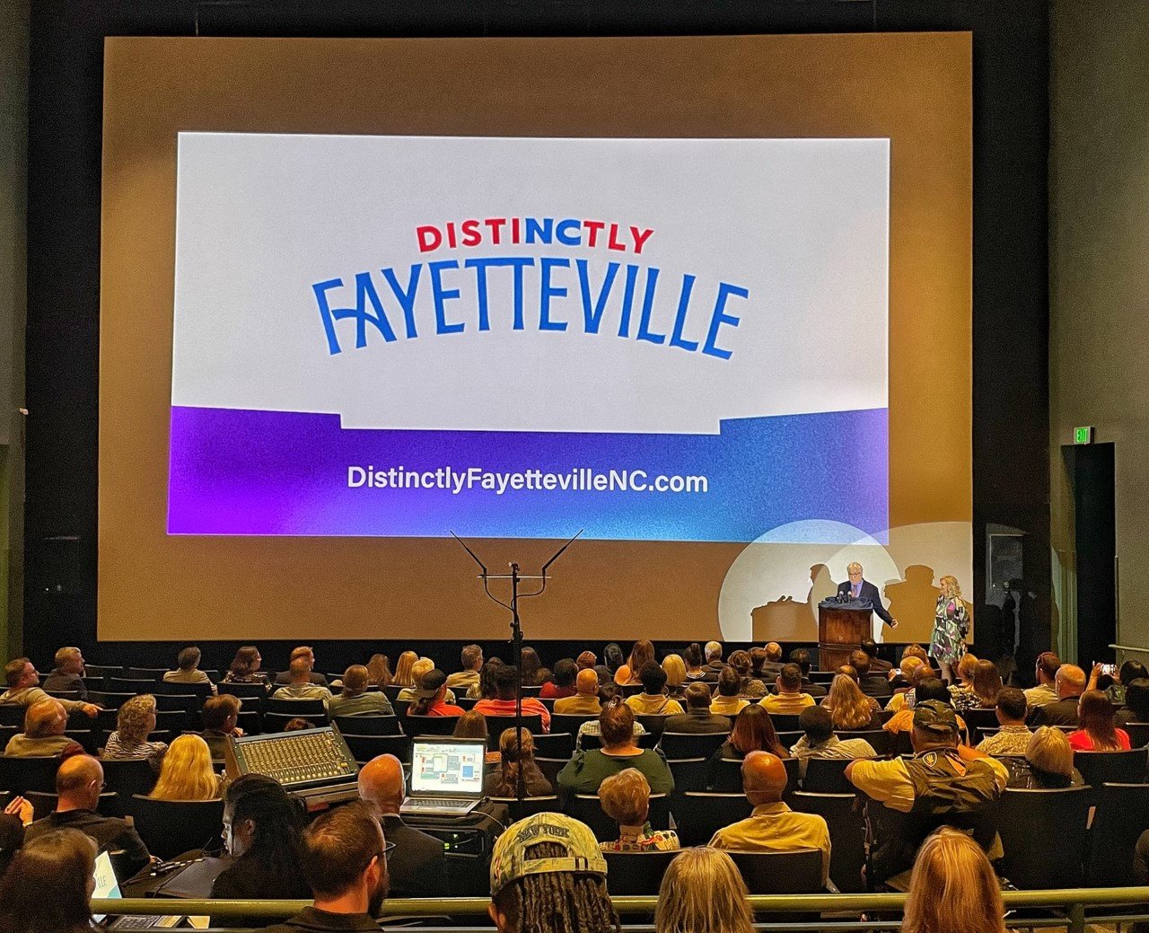 Randy Fiveash, interim president and CEO, reveals the new name and brand identity for the Fayetteville Area Convention and Visitors Bureau on Tuesday night at the Airborne & Special Operations Museum.