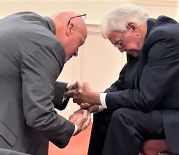 The Rev. Randy Moore, left, former pastor at Mount Elam Baptist Church in Spivey’s Corner, prays with the Rev. Keith Smith at Smith’s ordainment.