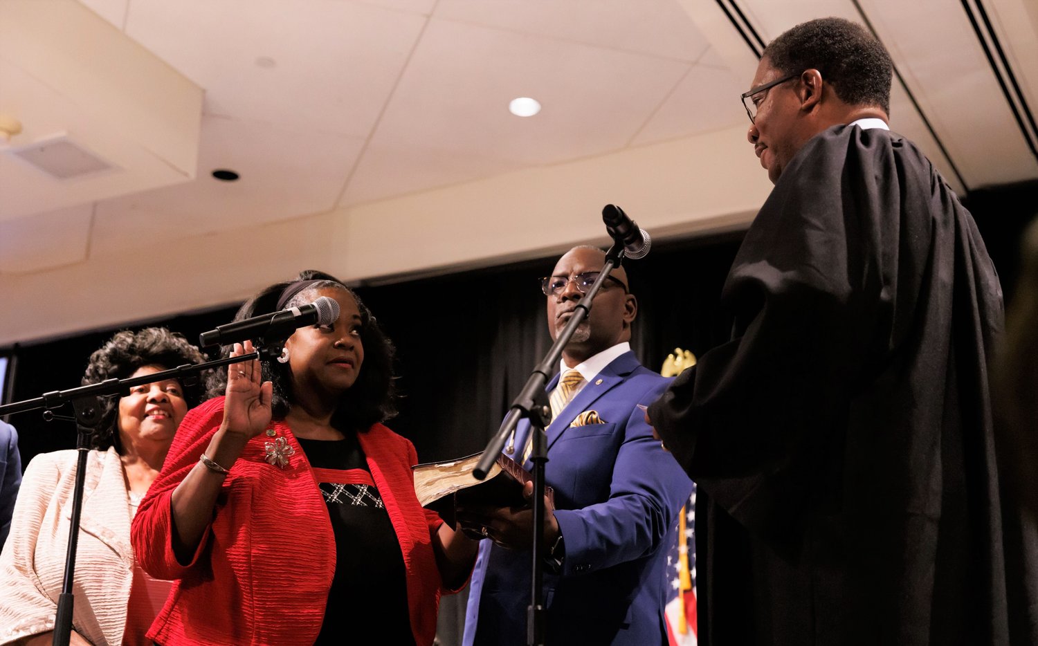 District Court Judge Stephen C. Stokes administers the oath of office to Veronica Jones as a new member of the Cumberland County Board of Commissioners on Monday night.