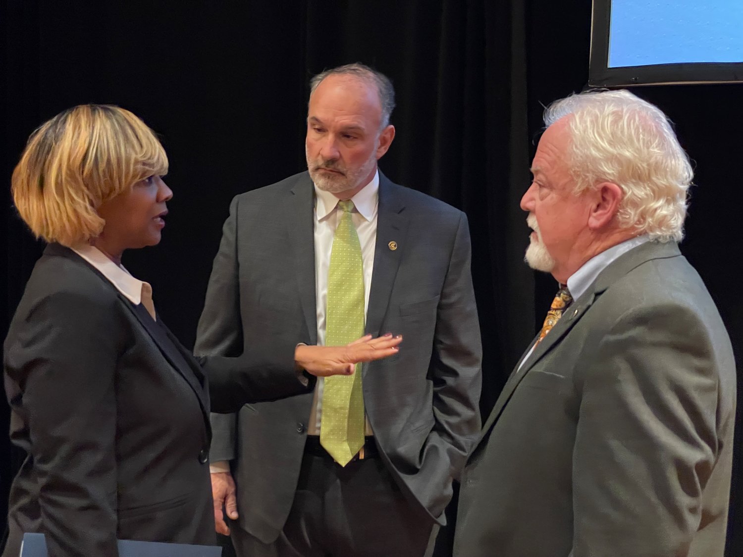 Board Chairwoman Toni Stewart talks with  Commissioners Jimmy Keefe and Michael Boose after Monday's meeting. Keefe and Boose voted against Stewart's nomination for chairwoman. The two said there was a lack of prior discussion about who would lead the board, and that their votes were nothing personal against Stewart.