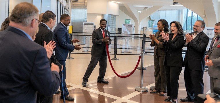 Mayor Mitch Colvin and Airport Director Toney Coleman cut the ribbon at a ceremony Wednesday to unveil renovations at Fayetteville Regional Airport.