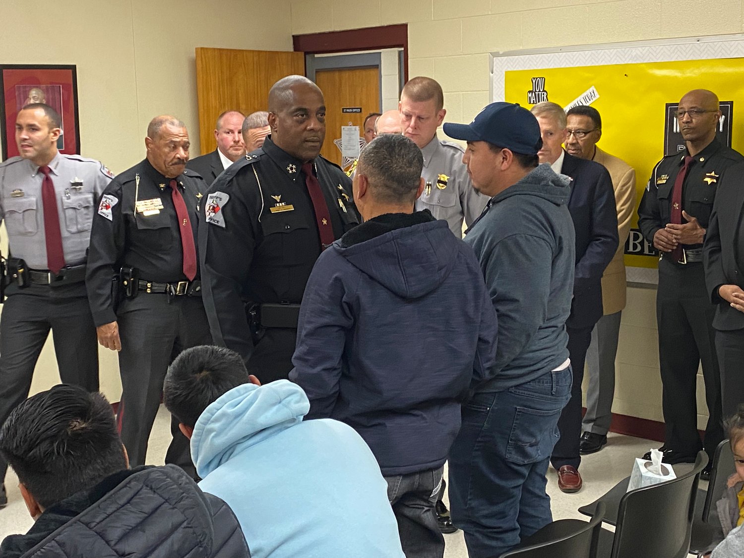 Cumberland County Sheriff Ennis Wright talks with members of Deputy Oscar Yovani Bolanos-Anavisca Jr.'s family following a news conference Friday.