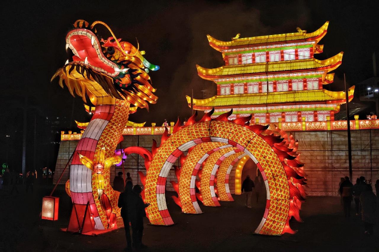 A dragon shaped tunnel leads to a lighted structure at the Chinese Lantern Festival in Cary.