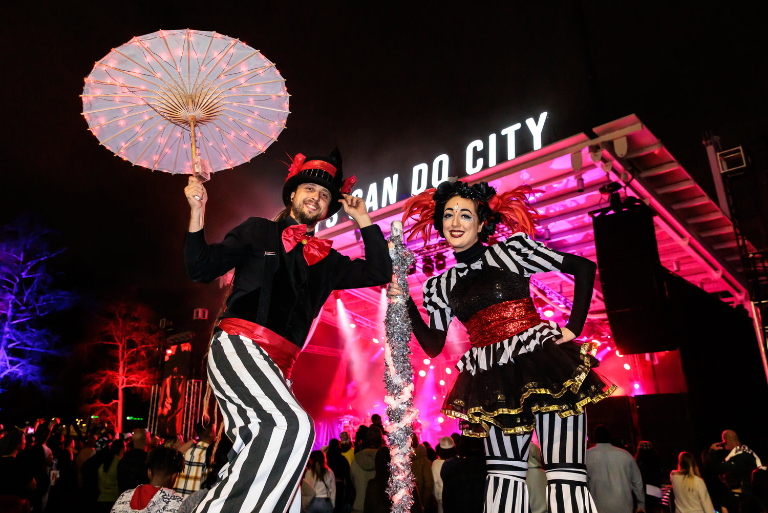 Stilt walkers, fire dancers and magicians added to the carnival-like atmosphere of Night Circus: A District New Year’s Eve Spectacular in Festival Park on Saturday.