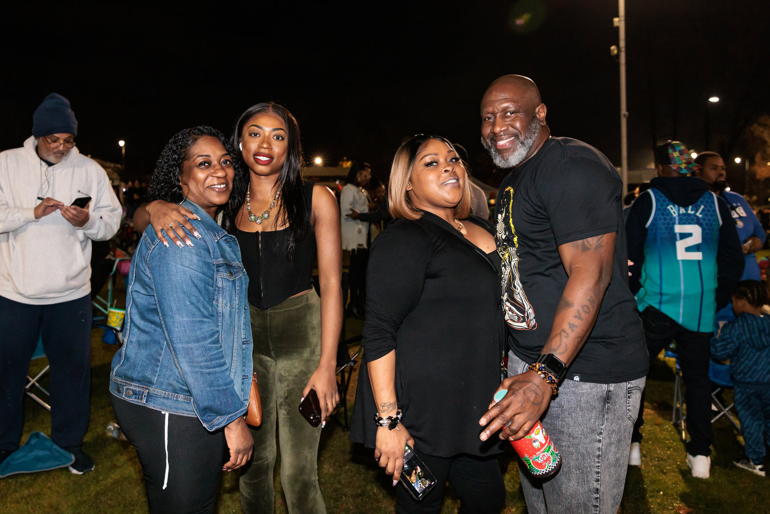 Taishemi Bougal, Taijai Prosser, Latoya McPherson, Derick Morrison celebrate the end of 2022 during the Cool Spring District's “Night Circus: A District New Year’s Eve Spectacular” in Festival Park.  R&B group Tony! Toni! Toné, and various circus acts performed into the New Year on Dec. 31, 2022.
