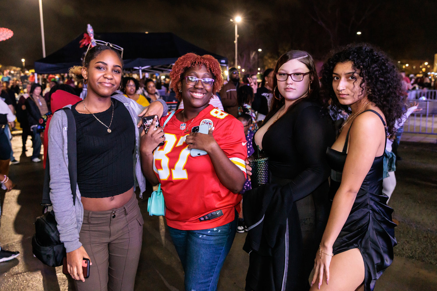 From left, Trinity Johnnson, Jada Leach, Emilie Medena, and Victoria Rivera enjoy New Year's Eve in Festival Park.
