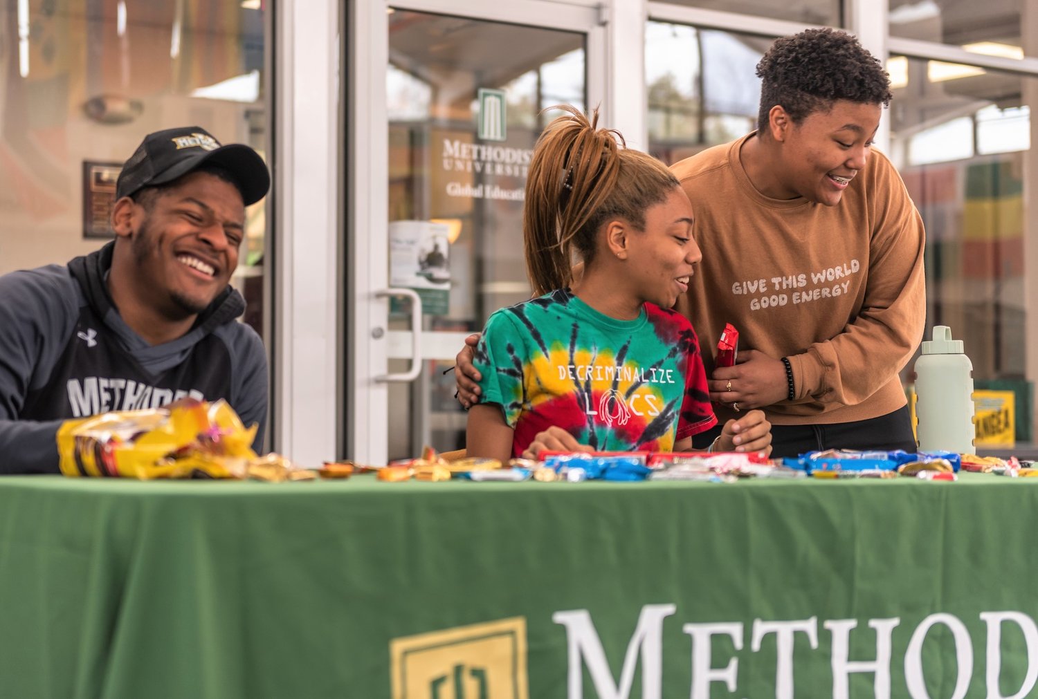 Students hand out giveaways and information at the Black Student Union signup table during Methodist University's celebration of Black History Month.
