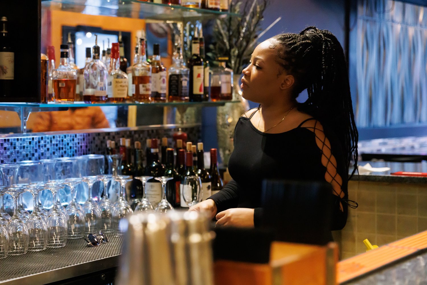 Shanniek Chambers, shift leader at Pierro's Italian Bistro, gets ready for customers at the bar.