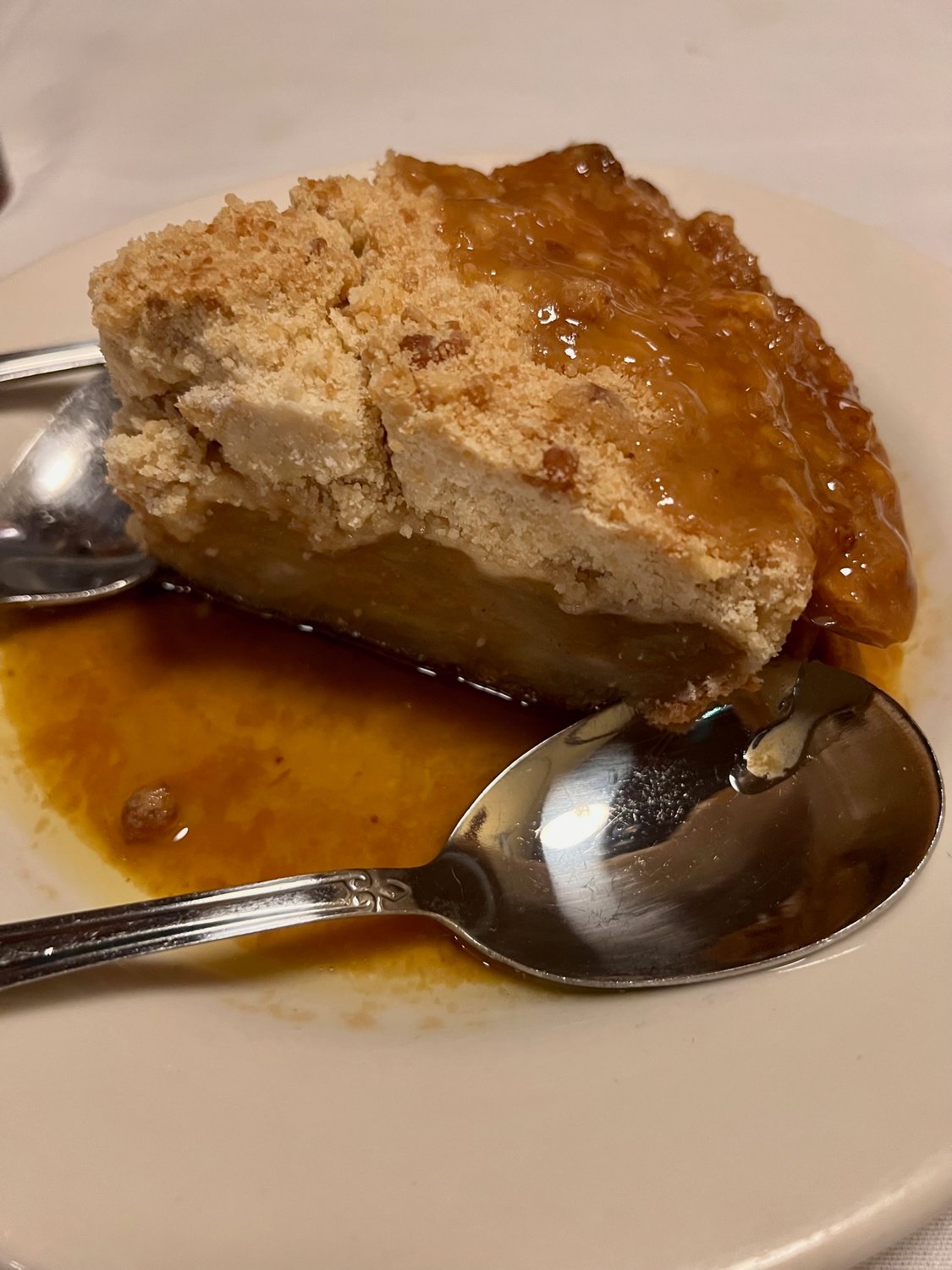 Apple pie topped with rum sauce can be served a la mode at the landmark 42nd Street Oyster Bar & Seafood Grill in downtown Raleigh.