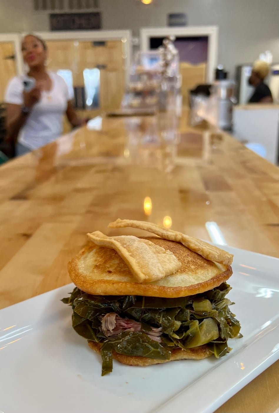 The collard green sandwich is famous at Henley’s Vintage Kitchen on Murchison Road.