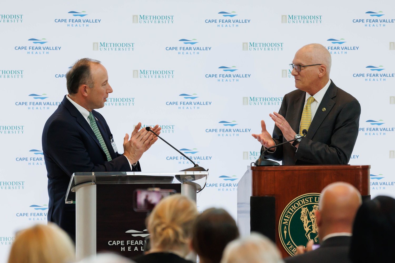 Mike Nagowski, left, CEO of Cape Fear Valley Health, and Methodist University President Stanley T. Wearden speak at a news conference Monday to announce a partnership to open a medical school in Fayetteville.
