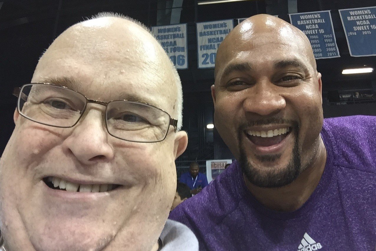 Earl Vaughan Jr., a longtime journalist covering high school sports, is shown with Anquell McCollum, who played for E.E. Smith and Western Carolina University and is in the WCU Hall of Fame.  The photo was taken in Carmichael Auditorium at the University of North Carolina at Chapel Hill during the 2016 3-A boys state basketball championship game between Terry Sanford and J.M. Robinson. Robinson won 59-55.