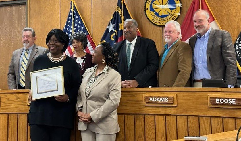 In recognition of Women's History Month, Cumberland County Board of Commissioners Chairwoman Toni Stewart, right front, recognized Vivian Tookes, left, the longest-serving county employee, on Monday night. Tookes has been with the Department of Social Services since Oct. 1, 1982. On back row are Commissioners Marshall Faircloth, Jennette Council, Glenn Adams, Michael Boose, and Jimmy Keefe.