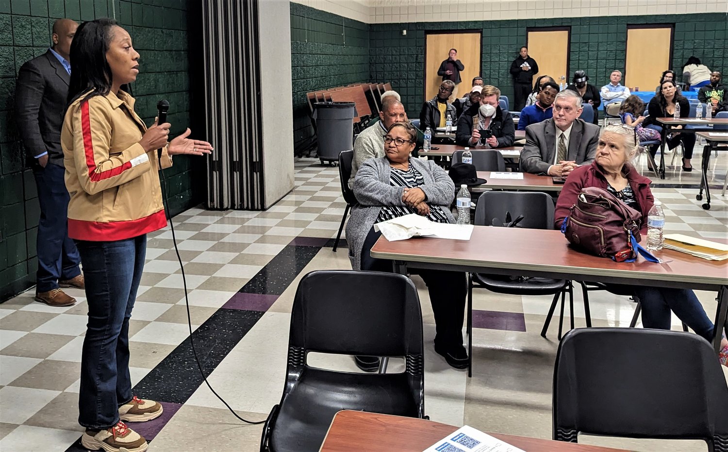 Fayetteville City Council member Courtney Banks-McLaughlin speaks to a crowd at Smith Recreation Center in Fayetteville. The residents were there to learn more about an office of community safety, an entity proposed by community organizers that would respond to mental health calls and hold the Fayetteville Police Department accountable.