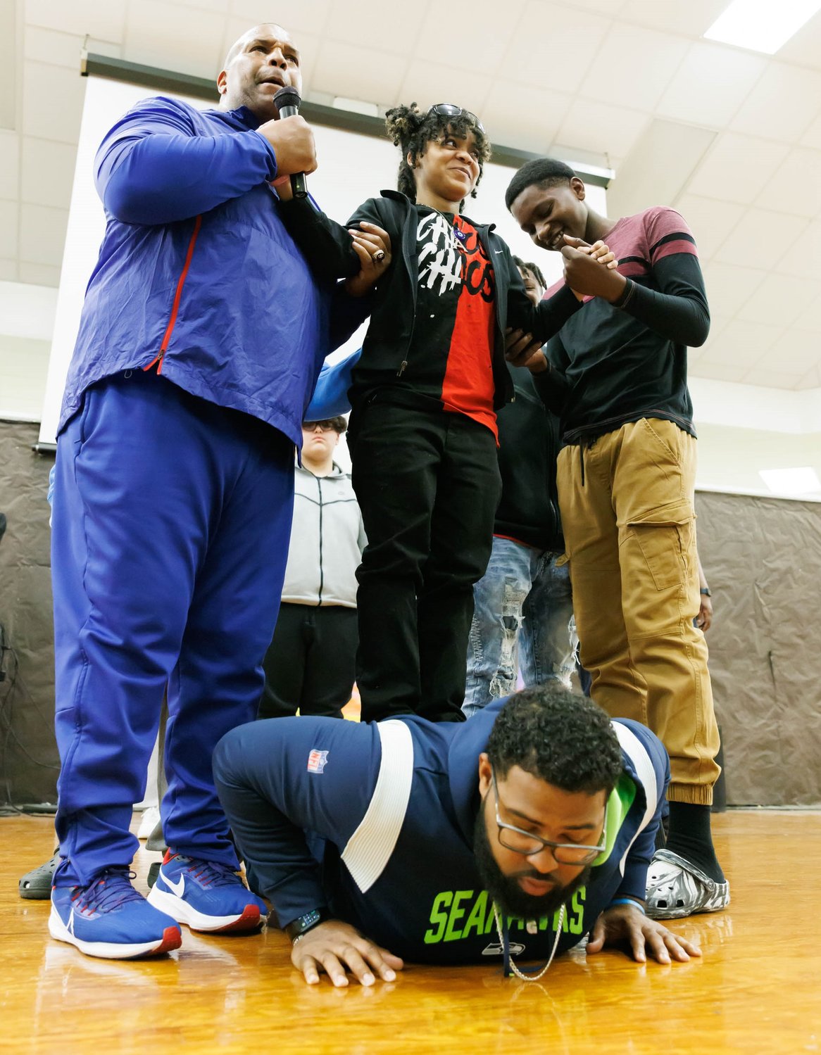 Keith Davis and Germard Reed, on floor, demonstrate a point at Luther "Nick" Jeralds Middle School.