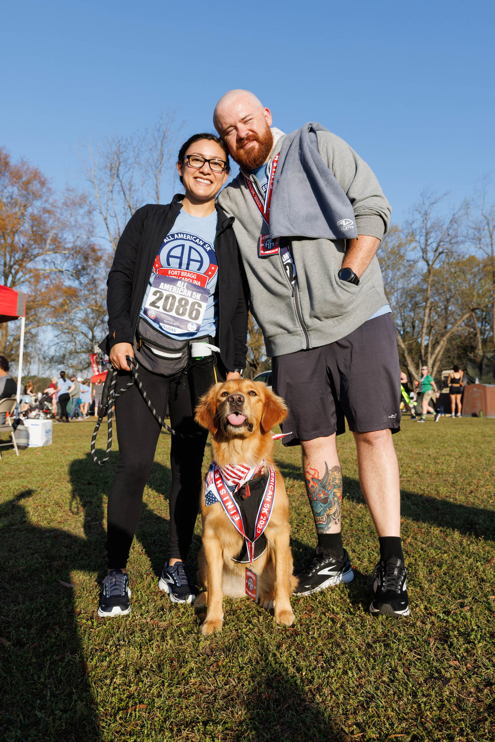 Paula and Kenneth Chevalir pose with their dog Lilith.  Kenneth and Lilith ran the the 5K All American Race together on March 23, 2023.  Tony Wooten/CityView Media