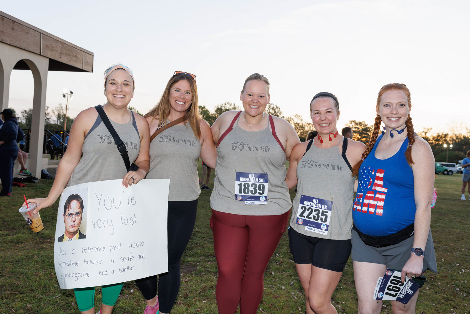 Heidi Baker, Olivia Ham, Laina Pluim, Kara Toman, and Emily Langley, representing the Fayetteville chapter of Sweat Like a Mother (S.L.A.M.), prepare for the start of the All American Races on  Fort Bragg on March 25, 2023.  Tony Wooten/CityView Media