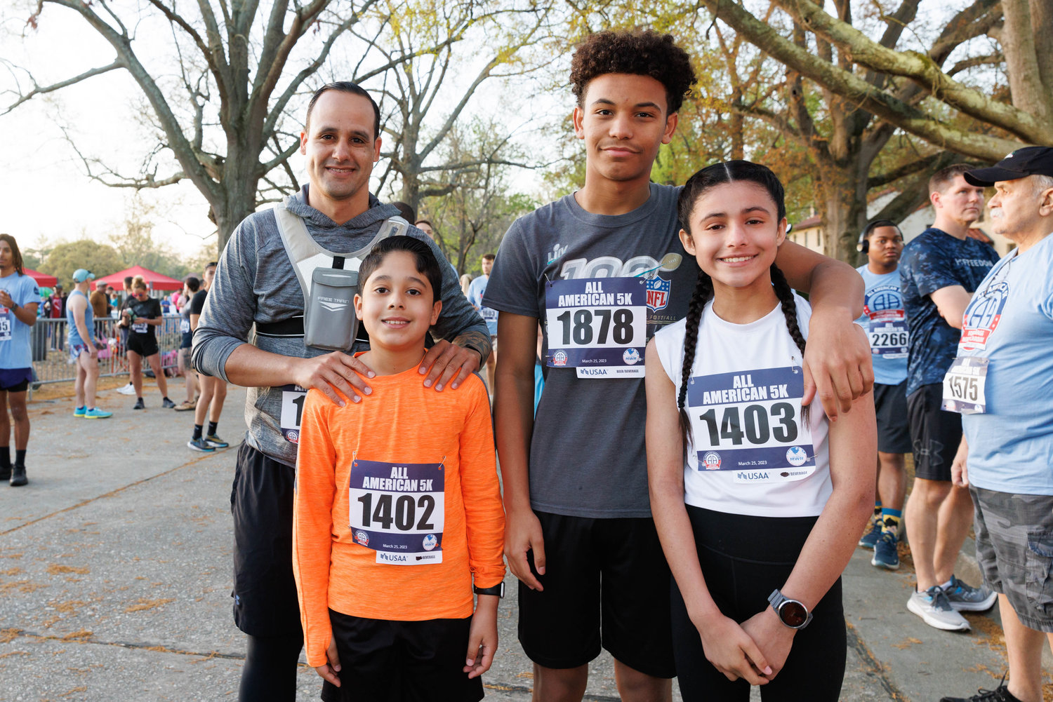 David Carattini, David Caratini Jr, Andy Reyes, and Isabella Caratini stand at the starting line of the 5K All American Race on Fort Bragg on March 25, 2023.  Tony Wooten/CityView Media