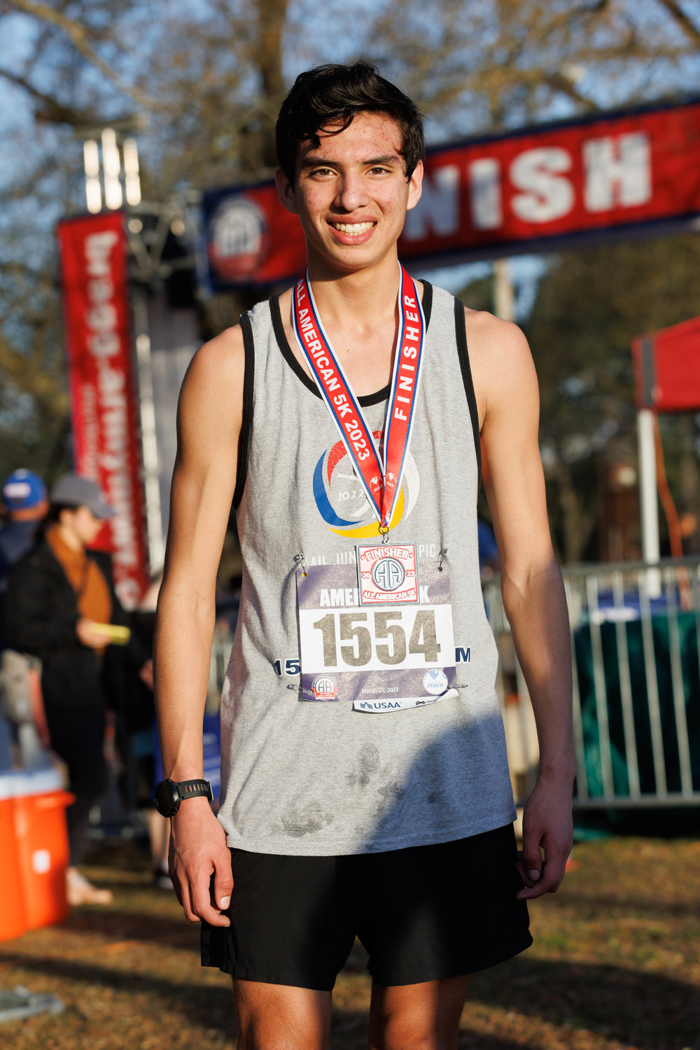 Bradley Garcia, a Massey Hill Classical High School student, is the first male to finish the 5K All American Race on March 23, 2023.  Tony Wooten/CityView Media