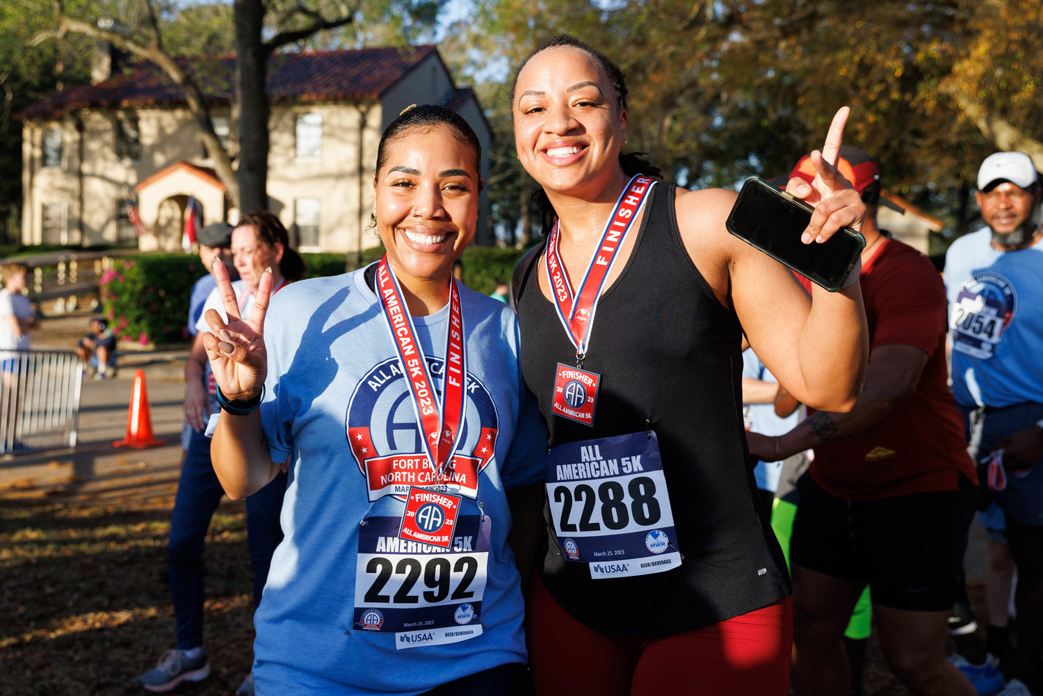 Lista Duwyeniehodges and Laquanda Henderson pose for a portrait after completing the All American Race on Fort Bragg on March 23, 2023.  Tony Wooten/CityView Media
