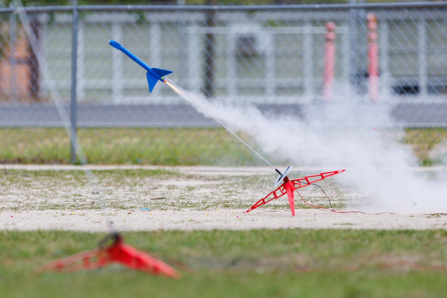 A rocket leaves a trail of smoke as it races toward the sky at the Seventy-First Classical Middle School STEM exercise on Wednesday.