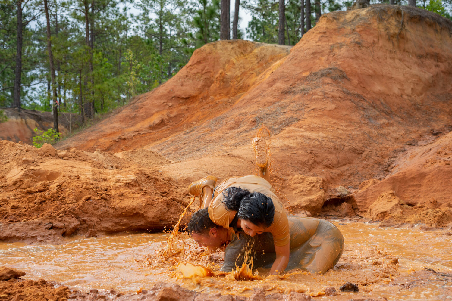 Cole Shumway and Nathaly Shumway participate in Fort Bragg's Mud Run on April 22 at McKellar's Lodge.
