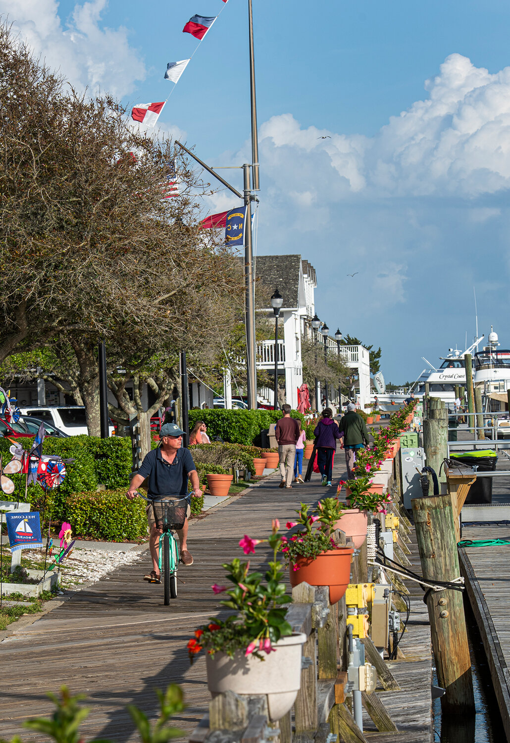 Lee Norris takes a ride on the boardwalk in historic Beaufort ‘just to see if the water was still there,’ he quips. Boutiques, bookstores and sweet shops give the town established in 1713 a homey feel.