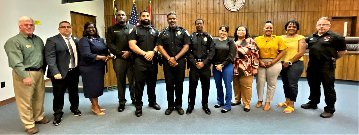Members of the Spring Lake Board of Aldermen recognize four police officers at their meeting Monday. From left are Alderman Marvin Lackman; Alderman Raul Palacios; Mayor Pro Tem Robyn Chadwick; Police Chief Dysoaneik Spellman; Patrol Officers P. Paulo, C. Causey and M. Passmore; Detective A. Hurtt;  Alderwoman Sona Cooper; Mayor Kia Anthony; Alderwoman Adrian Thompson; and interim Town Manager Jason Williams.