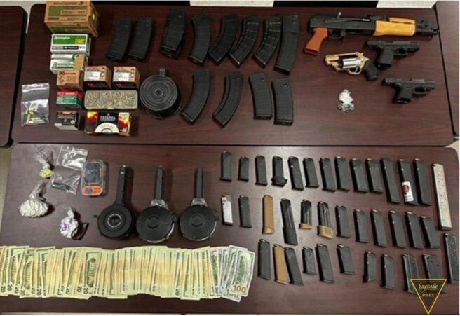 Police seized four firearms, three Glock auto-sear switches; 1,452 rounds of ammunition; 42 bindles of fentanyl; 57 Xanax pills and 
$3,203 during an arrest on the 1200 block of Berkshire Road on May 4, 2023.