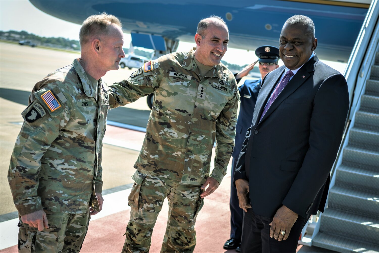 Secretary of Defense Lloyd J. Austin III is greeted by U.S. Army Forces Command commanding general Gen. Drew Poppas and Command Sgt. Maj. Todd Sims after arriving at Pope Army Airfield on Friday. Austin visited Fort Bragg and Fayetteville State University to highlight the department’s focus on the national service.
