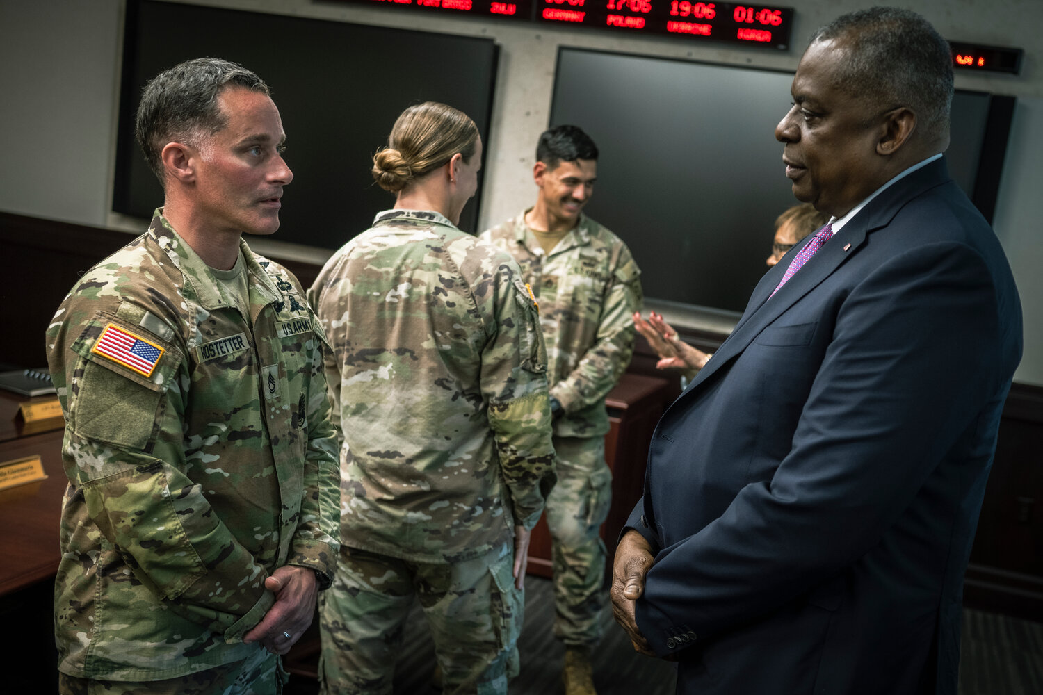 Secretary of Defense Lloyd J. Austin III speaks with Sgt. 1st Class Brian Hostetter during a visit with families assigned to the 82nd Airborne Division at Fort Bragg on Friday.