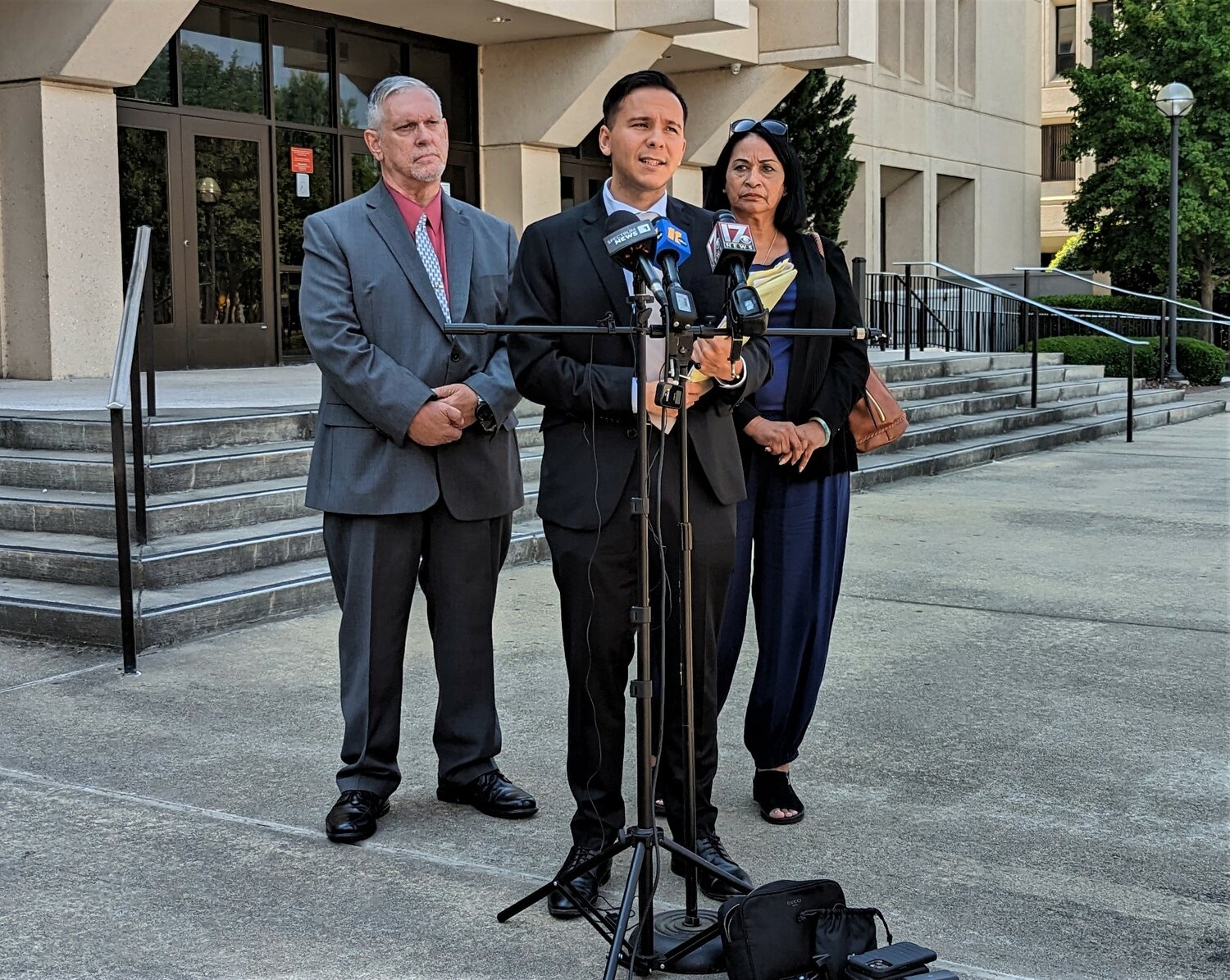 Xavier de Janon, a lawyer representing Rick and Maria Iwanski, speaks to reporters Wednesday following the N.C. Department of Justice’s decision not to charge police officers who killed Jada Johnson. Johnson’s grandparents, The Iwanskis stand behind de Janon.