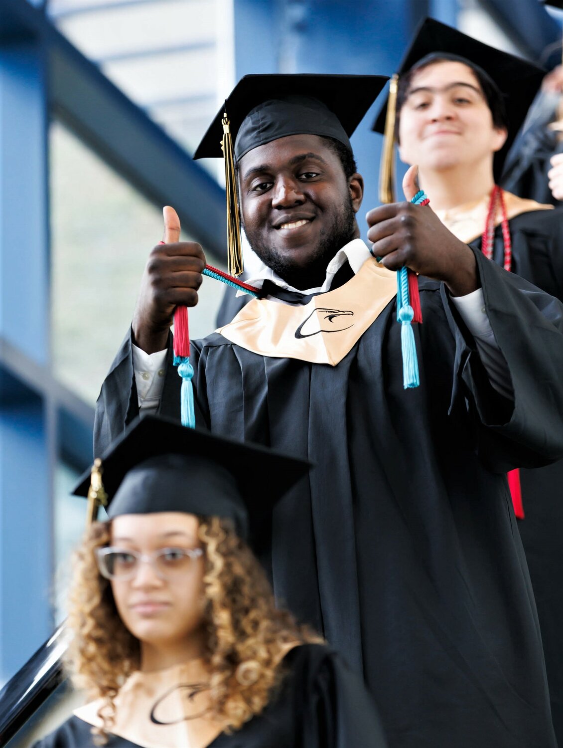 A student gives the thumbs up at the Cross Creek Early College High School on Thursday at the Crown Coliseum for the Cumberland Polytechnic High School commencement.