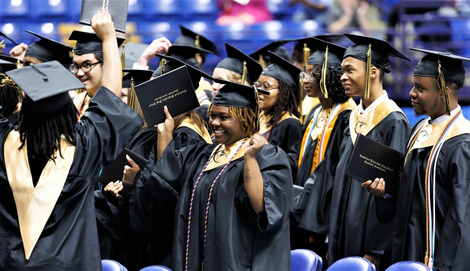 Students of Cumberland Polytechnic High School celebrate graduation Thursday at the Crown Coliseum.