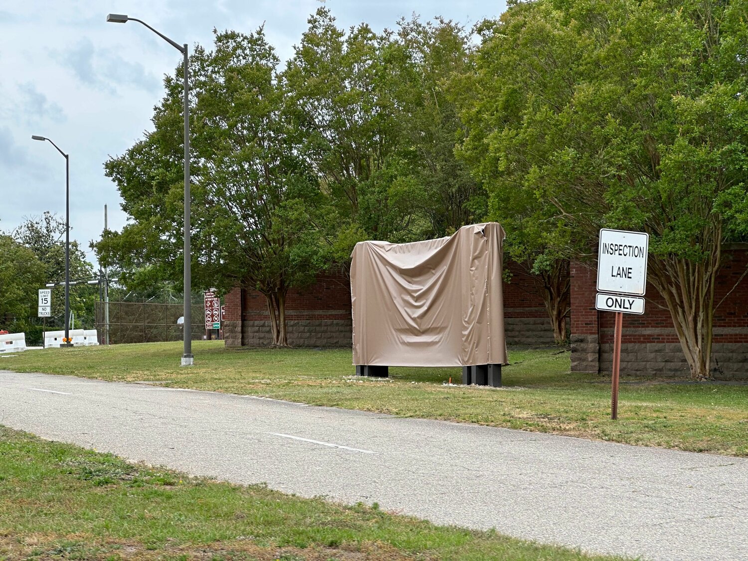 A sign at the Randolph Gate on Fort Bragg is covered until the reveal of the new name, Fort Liberty, next week.